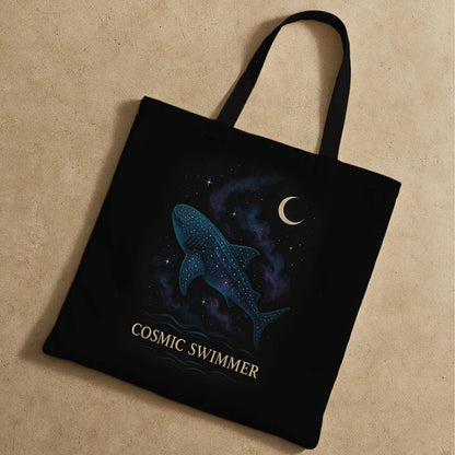  Stylish tote bag displaying a cosmic swimmer motif, combining space, whale shark and water imagery in a colorful design.