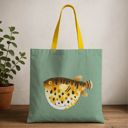 A tote bag featuring a colorful puffer fish design on a light background.