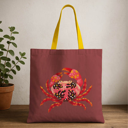 A tote bag featuring a colorful crab design, perfect for beach outings or casual use.