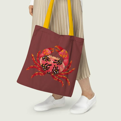 A tote bag with a detailed crab design, combining functionality with a fun marine theme.