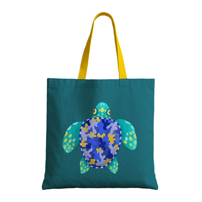 A colorful tote bag in blue and yellow, featuring a turtle motif, ideal for carrying essentials with a marine flair.