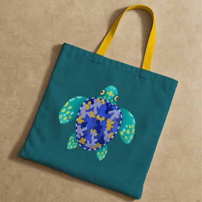 A stylish tote bag in blue and yellow, decorated with a cheerful turtle illustration for a fun accessory.