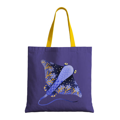 A blue and yellow tote bag decorated with a stingray, combining functionality with marine-themed design.