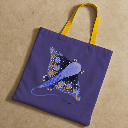 A blue and yellow tote bag showcasing a stingray illustration, perfect for casual outings.