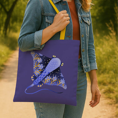 A stylish tote bag in blue and yellow, adorned with a graphic of a stingray.