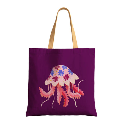 A purple tote bag displaying a whimsical jellyfish motif.