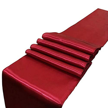 Red table runner with four crisp folds.