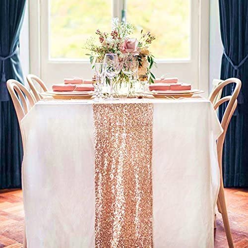 Dining table covered pink Table runner.