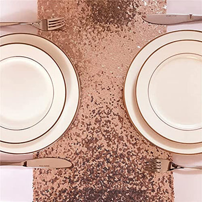 A table setting with plates and silverware on a white table cloth.