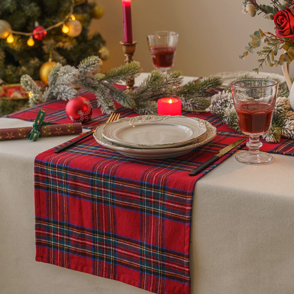 A charming table setting with red and blue plaid placemats, enhancing the dining experience with a touch of color.