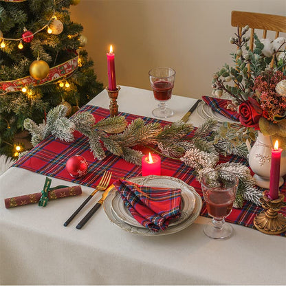  A stylish table setting adorned with red and blue plaid placemats, ideal for family gatherings or casual meals.