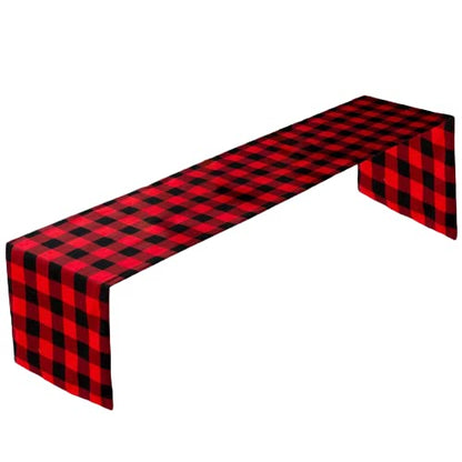  A table featuring a red and black plaid tablecloth, creating a stylish and rustic atmosphere.