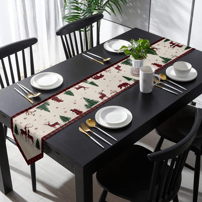 A decorative table runner adorned with deer and pine trees, ideal for adding a touch of nature to your dining space