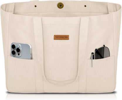 Beige tote bag with multiple pockets and a phone and sunglasses inside, branded 'The Purple Tree'.
