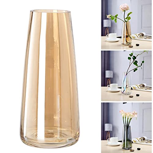 Lovely flowers in a vase on a table with a variety of blooms.