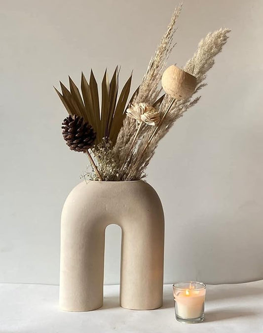 Delicate white vase showcasing a lovely flower