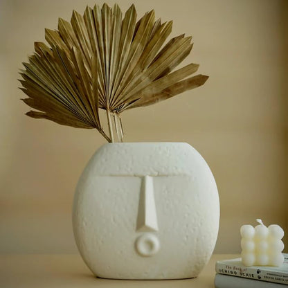Unique flower vase featuring a cute face design, perfect for adding a fun and quirky element to your space.