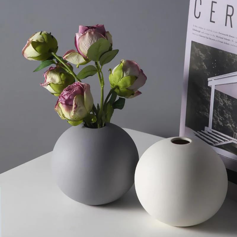 Vases holding flowers on a table