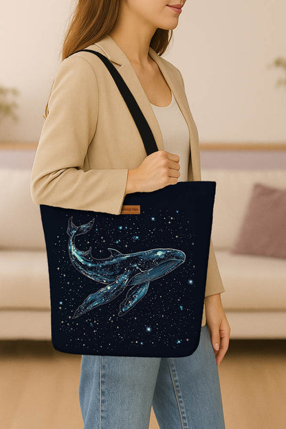  A stylish tote bag adorned with a whale and star pattern, perfect for casual outings.