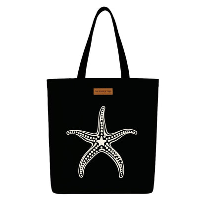 A black tote bag featuring a starfish design, ideal for beach outings or casual use.

