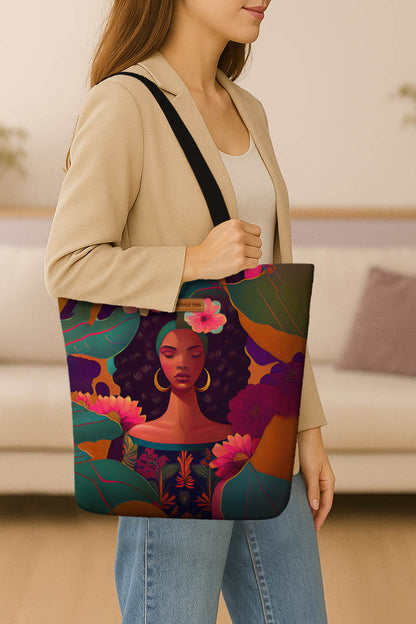 A tote bag displaying an artistic image of a woman adorned with flowers and leaves, emphasizing a floral theme.