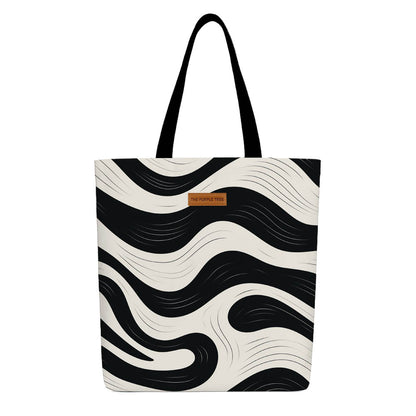 Black and white zebra print tote bag with sturdy handles, ideal for shopping or casual outings.
