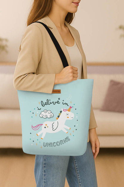 A cotton tote bag adorned with a whimsical unicorn graphic.