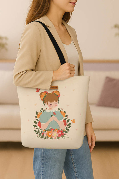 A tote bag depicting a girl with flowers and butterflies, showcasing a vibrant and cheerful design.