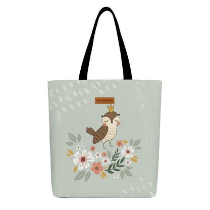 A tote bag featuring a colorful owl surrounded by vibrant flowers on a light background.

