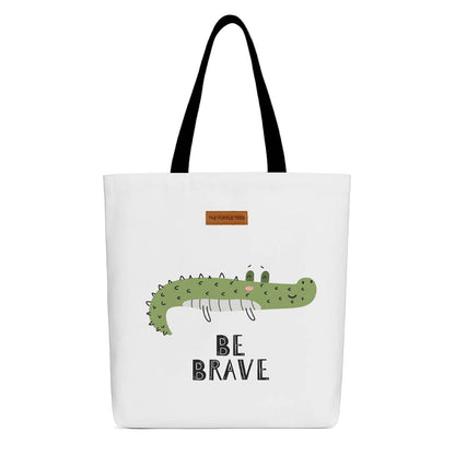 Tote bag featuring a brave crocodile design, showcasing vibrant colors and playful graphics.

