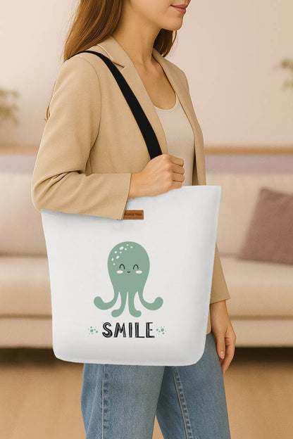 A tote bag adorned with an octopus illustration and the cheerful message "Smile."