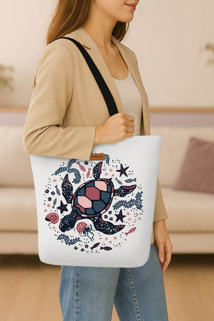 A stylish tote bag adorned with a vibrant turtle graphic.